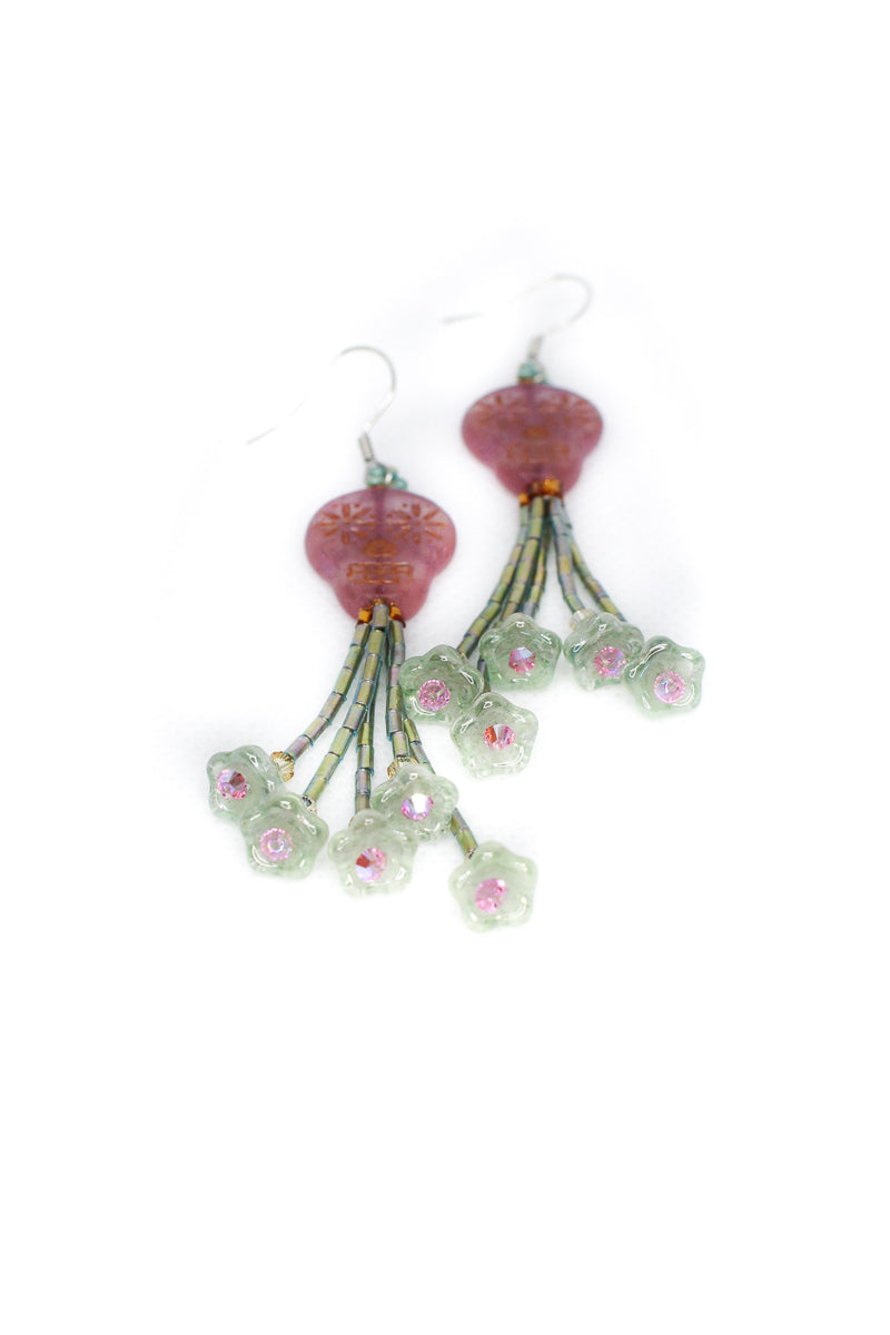 Green flower tassel earrings with pink sugar skulls