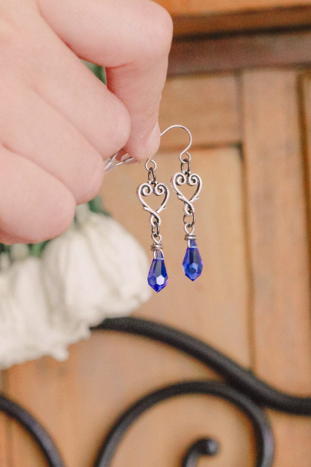 Elegant sapphire blue crystal heart drop earrings. A seamless choice for a “something blue” bridal gift.” #blueearrings #somethingblue #somethingbluegift #crystalearrings #heartdropearrings #crystaldropearrings