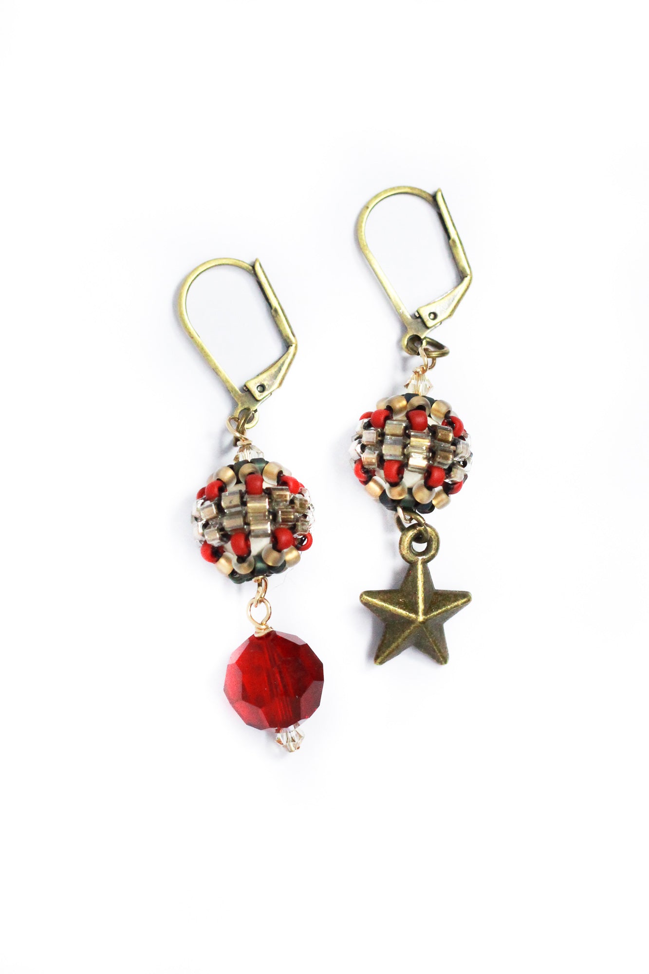 Red Crystal & Brass Star Dangle Earrings by Kaleidoscopes And Polka Dots