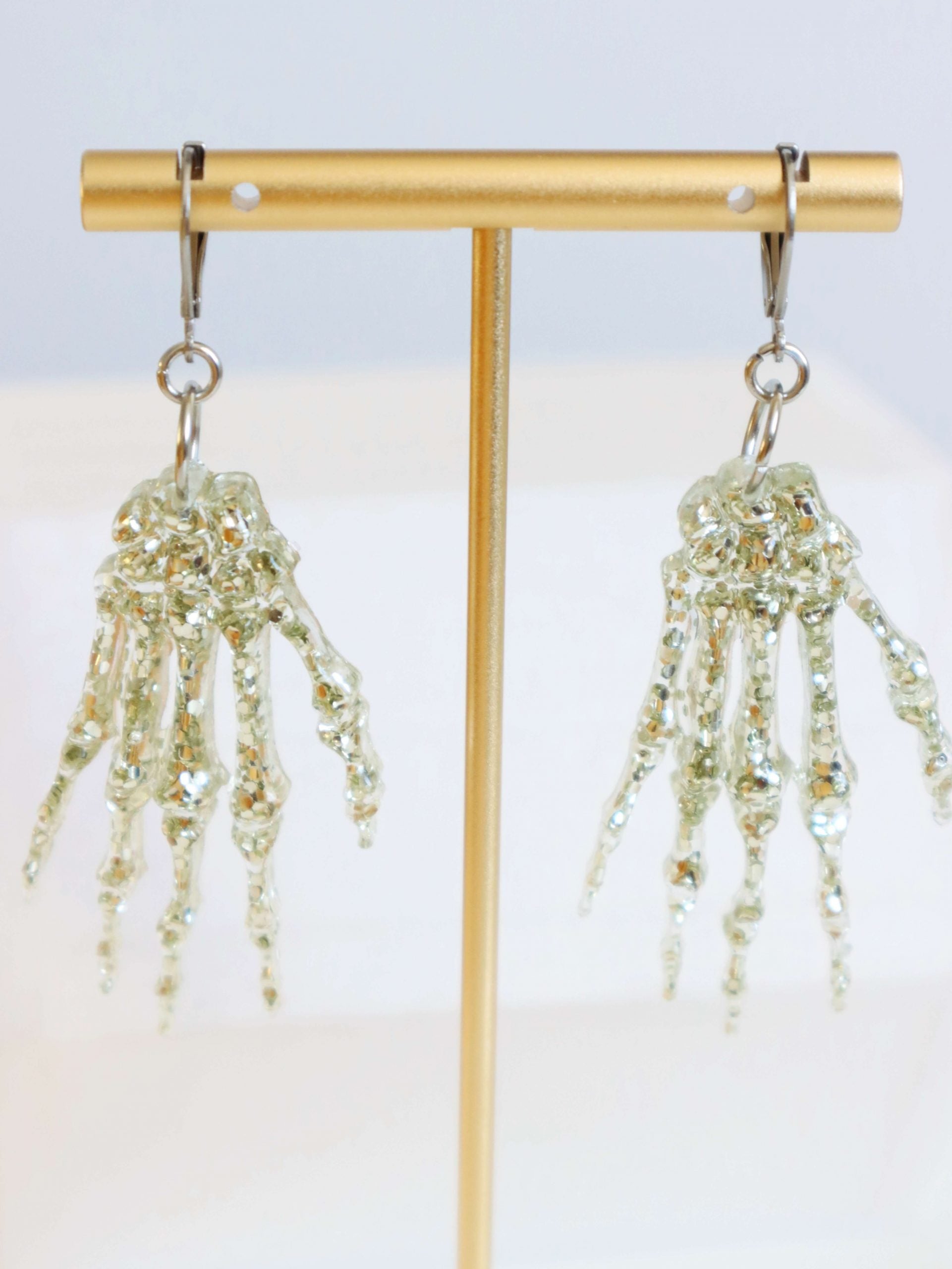 silver-glitter-skeleton-hand-statement-earrings-by-kaleidoscopes-and-polkadots