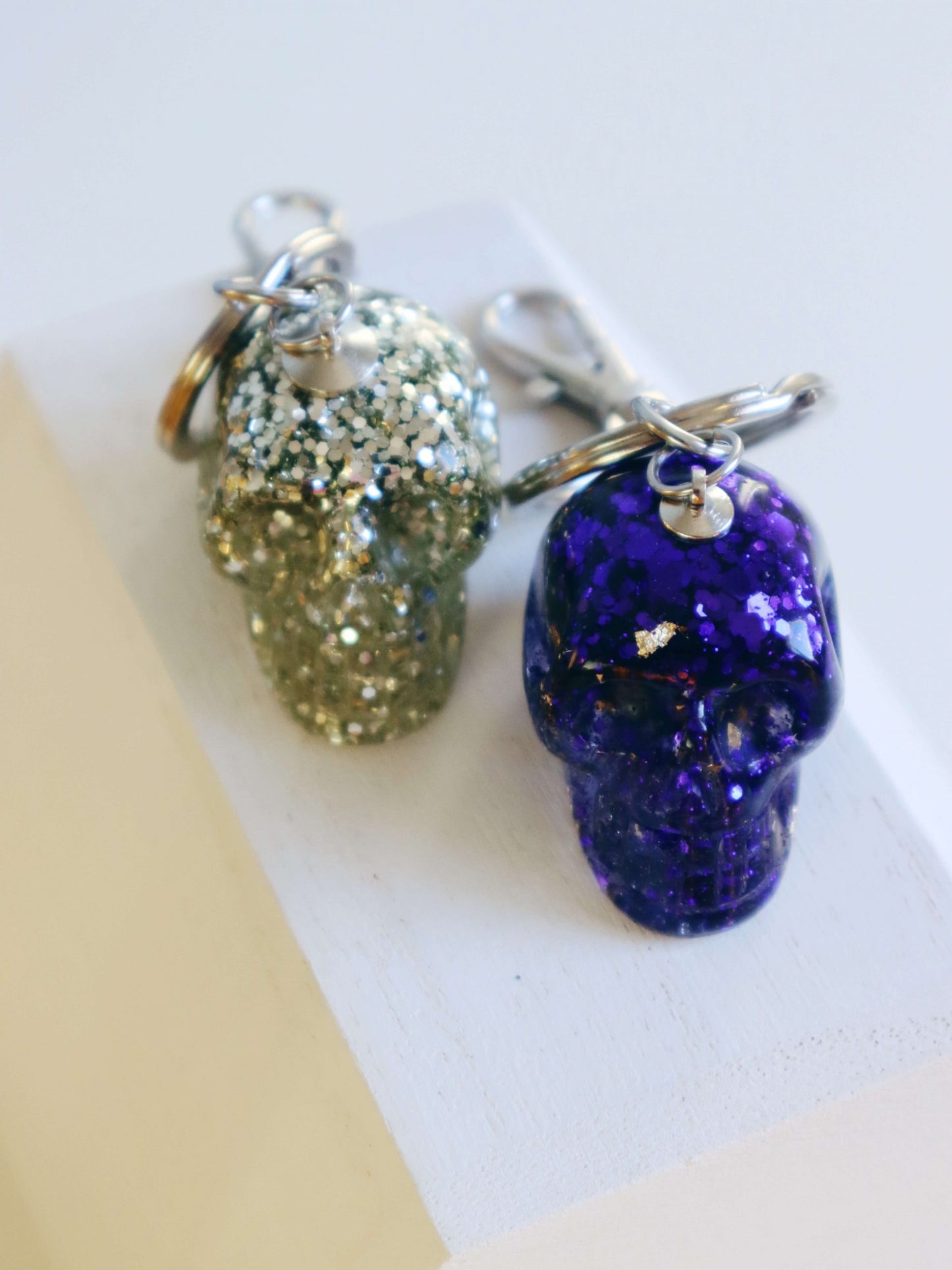 silver-glitter-skull-and-purple-glitter-skull-keychains-by-kaleidoscopes-and-polka-dots