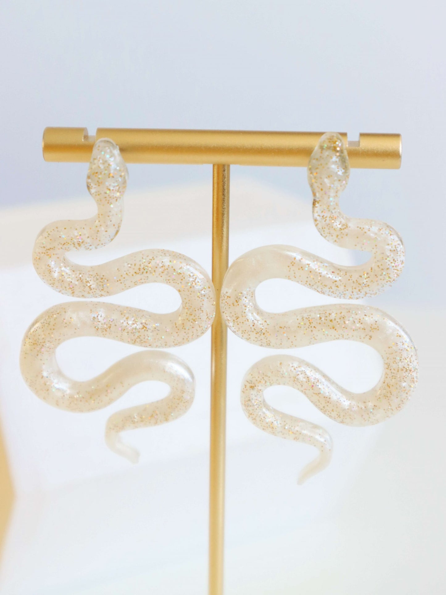 gold-glitter-white-pigment-snake-earrings-by-kaleidoscopes-and-polka-dots